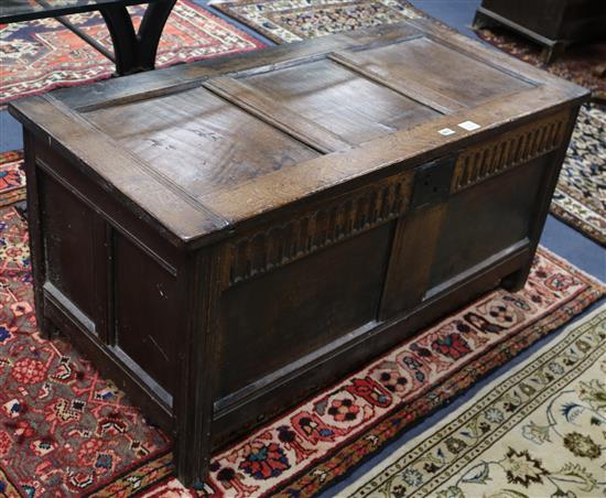 A 17th century oak coffer W.122cm